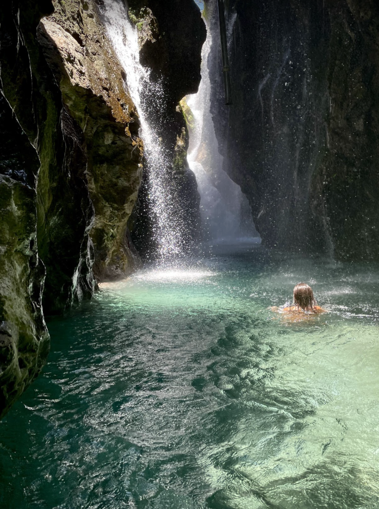 solo female travel swimming in the waterfalls of Greece